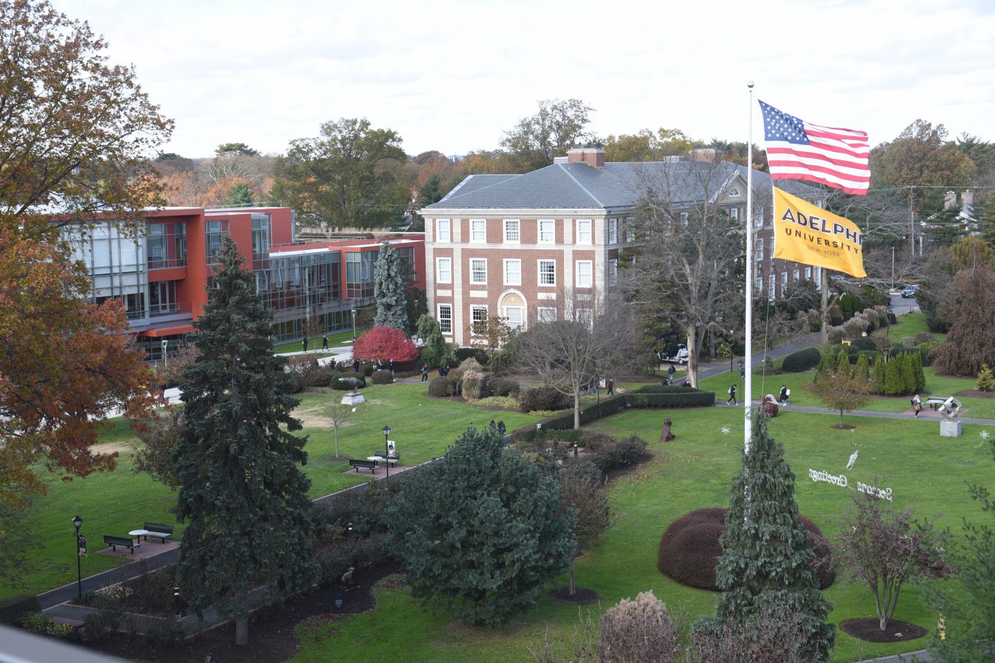 Aerial view of Adelphi University, Garden City campus - Showing Nexus Building, Levermore Hall and the Flagpole lawn with both American and Adelphi flags waving.