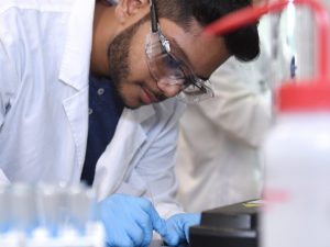 Adelphi student working in the labratory.