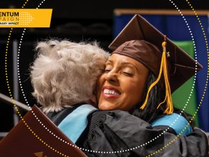 A graduate hugging their professor at Adelphi University Commencement. Momentum Campaign for Adelphi University