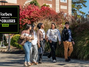 Adelphi University students walking on campus in he fall.
