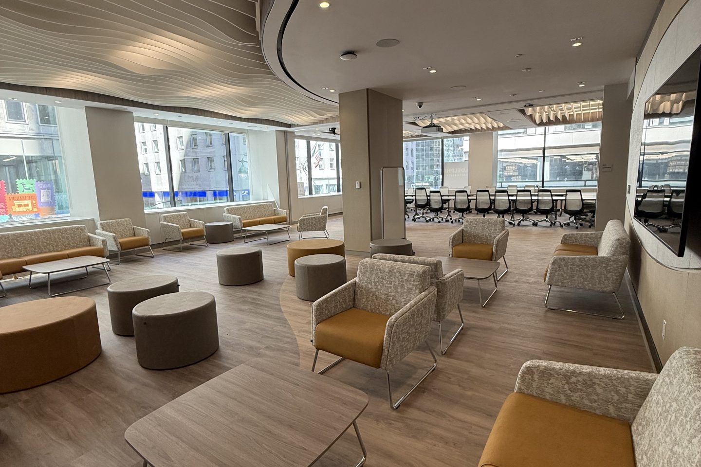 Room with large windows and chairs.