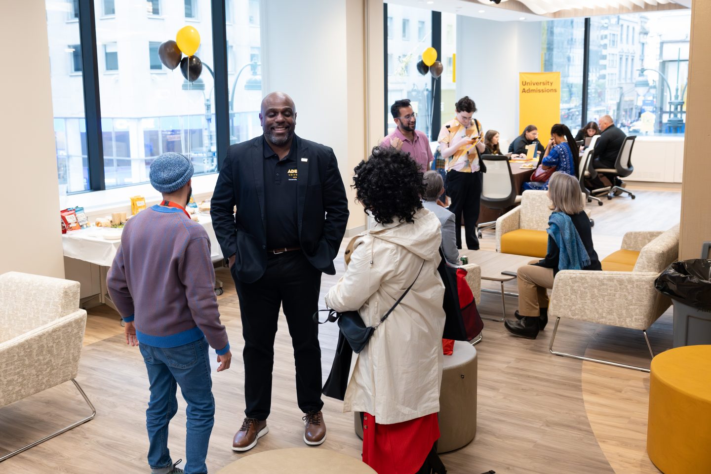 Faculty and visitors on the student lounge at the Manhattan Center