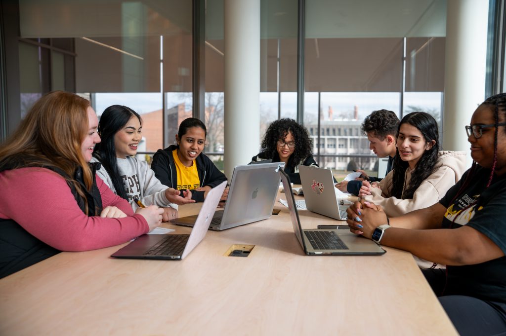 A group pf Adelphi University students studying together in the Nexus Building on campus