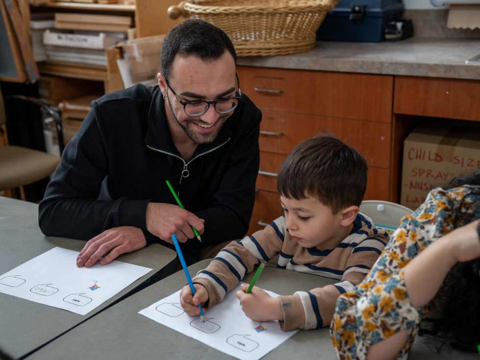 Education student teaches young child at the Alice Brown Early Learning Center at Adelphi University
