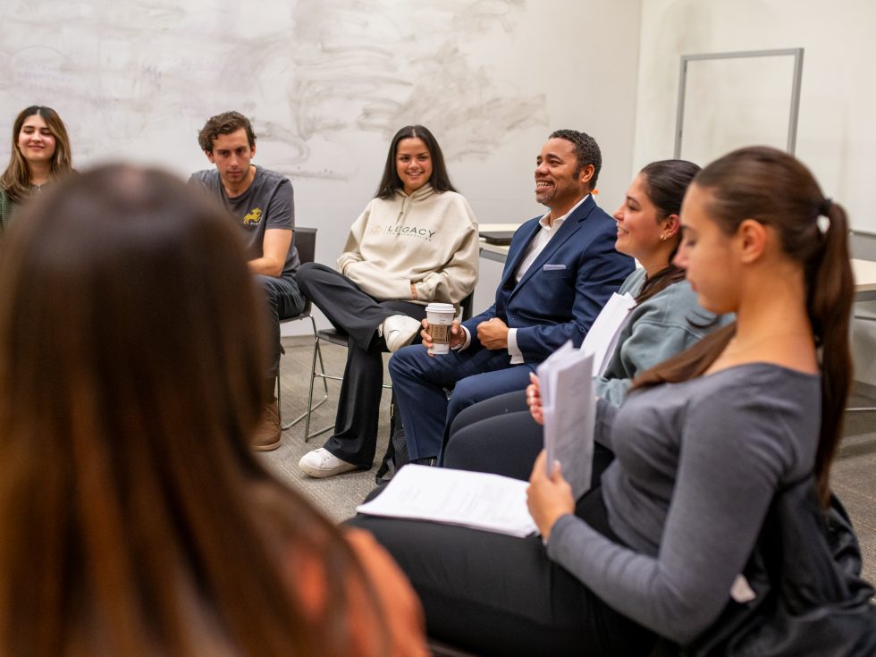 Errol Rodriguez working with master-level students in the classroom