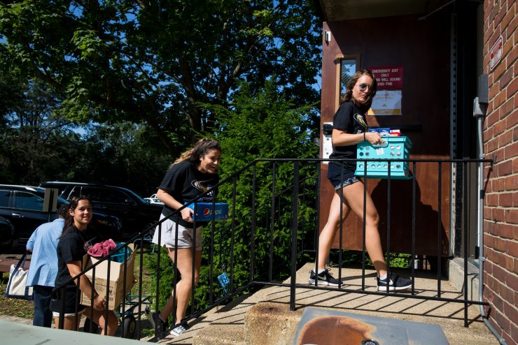 Move in day at Adelphi: Students taking boxes into the residential halls.