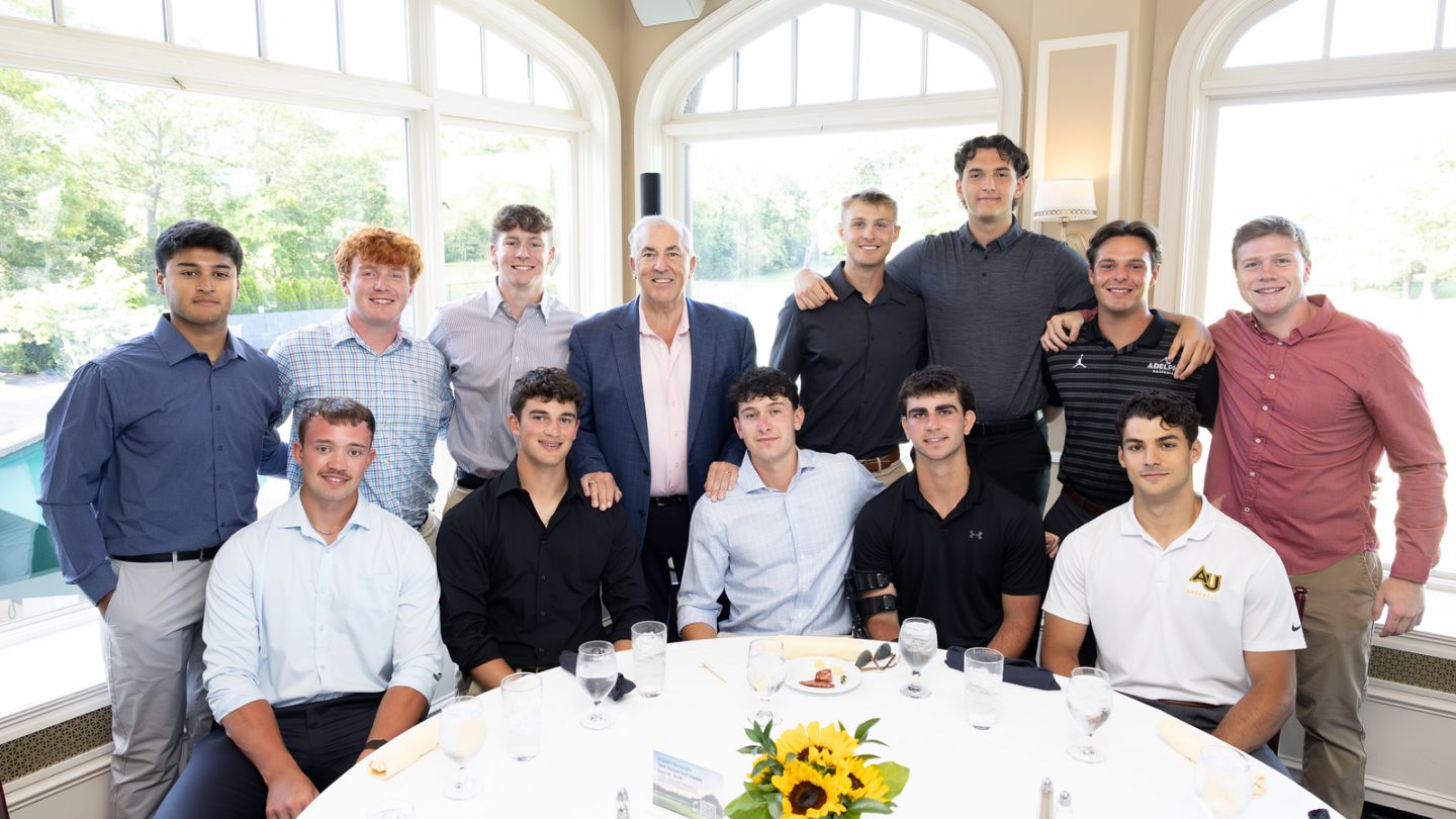 Michel Balboni with student-athletes from Adelphi University's Baseball program at the 2026 Golf Classic.