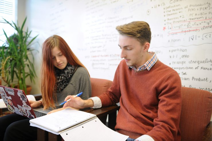 Two students in the math department study together.