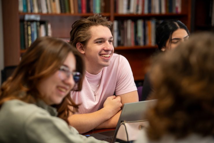 An Adelphi University student smiles during an seminar