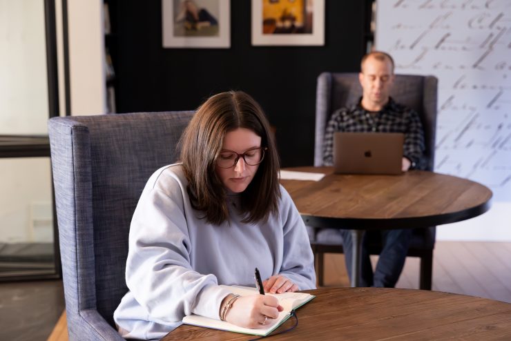 An Adelphi university student writing