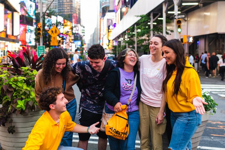 Adelphi students laughing in time square NYC