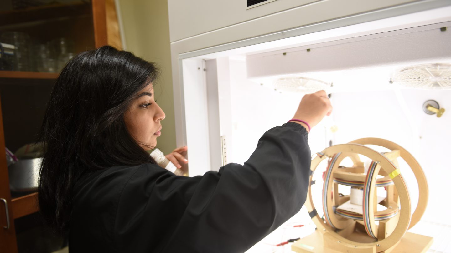 Student in physics lab