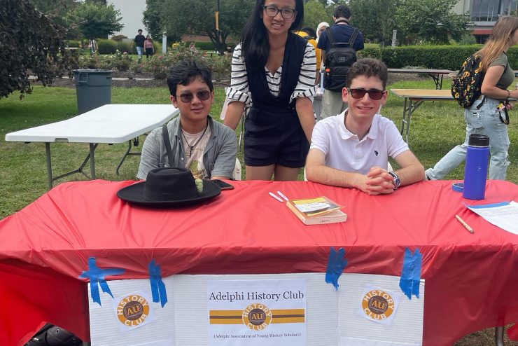 Adelphi University History Club at a club fair table.