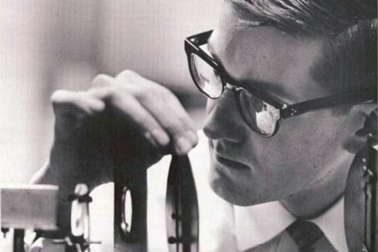 1965 yearbook image of student working in the science lab