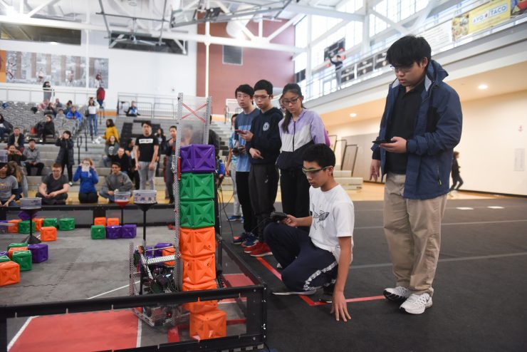 VEX Robotics: Students put STEM skills into action during a robotics competition, collaborating, problem-solving, and showcasing innovative designs on the competition floor.
