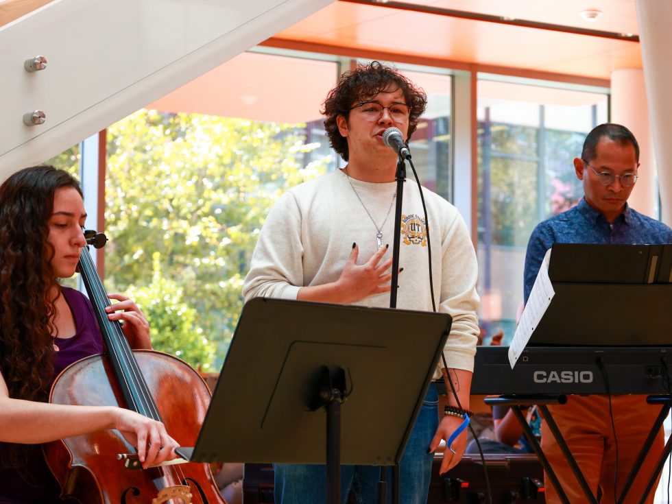 An Adelphi violinist playing during a performance on campus.