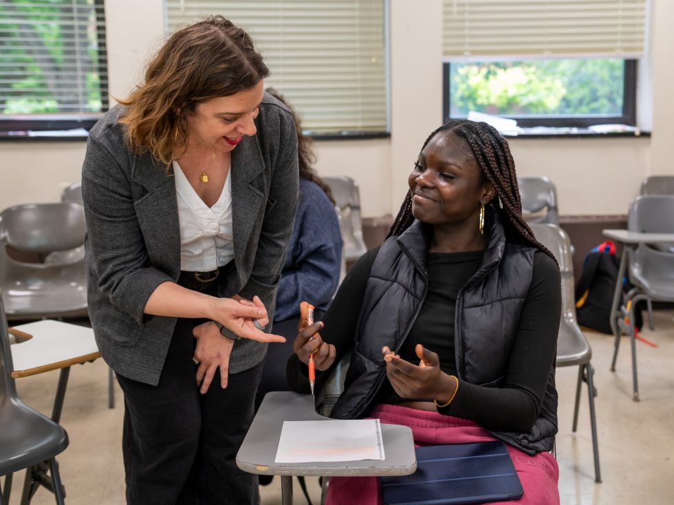 Professor Lauren Rosenblum working on-on-one with an Adelphi student in the interdisciplinary studies program.