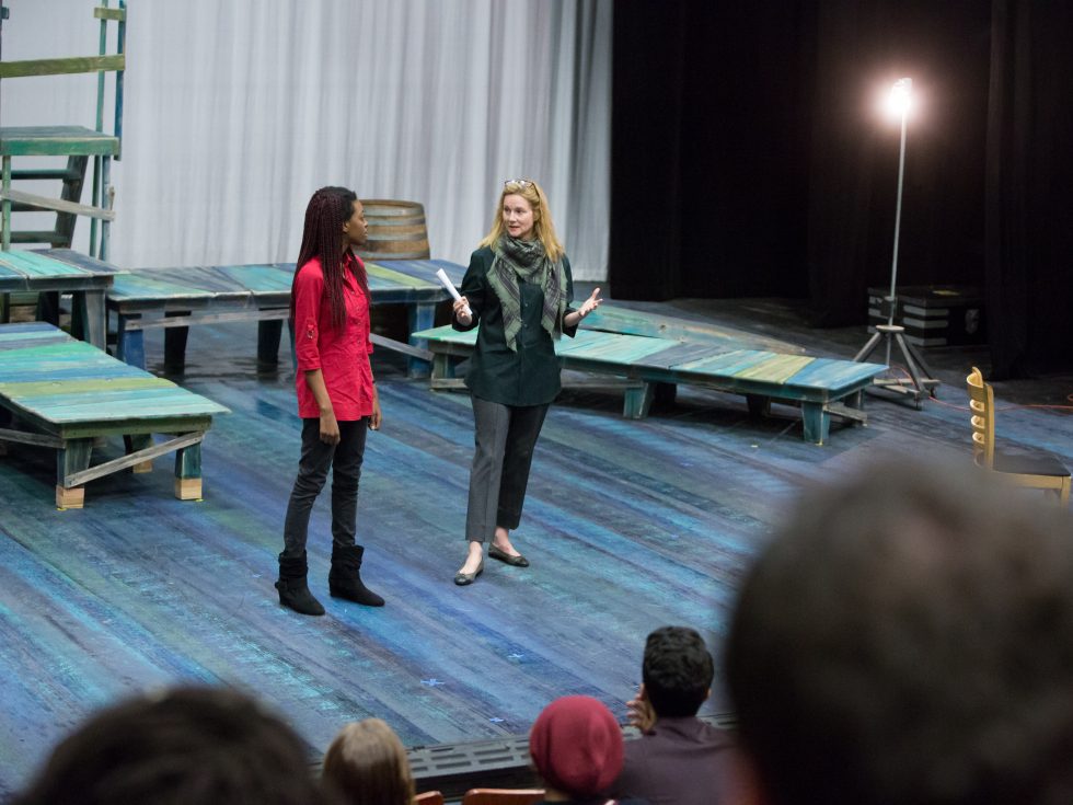 Adelphi Best of Broadway. Performance showing a group of student on stage pointing up singing in unison.