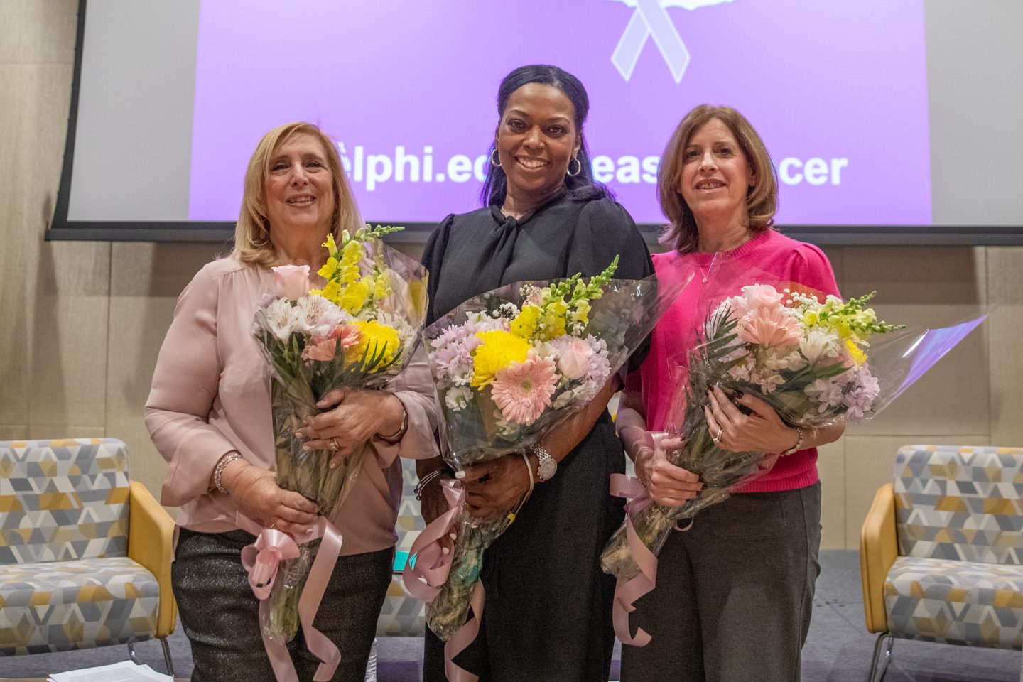Three women with bouquets of flowers