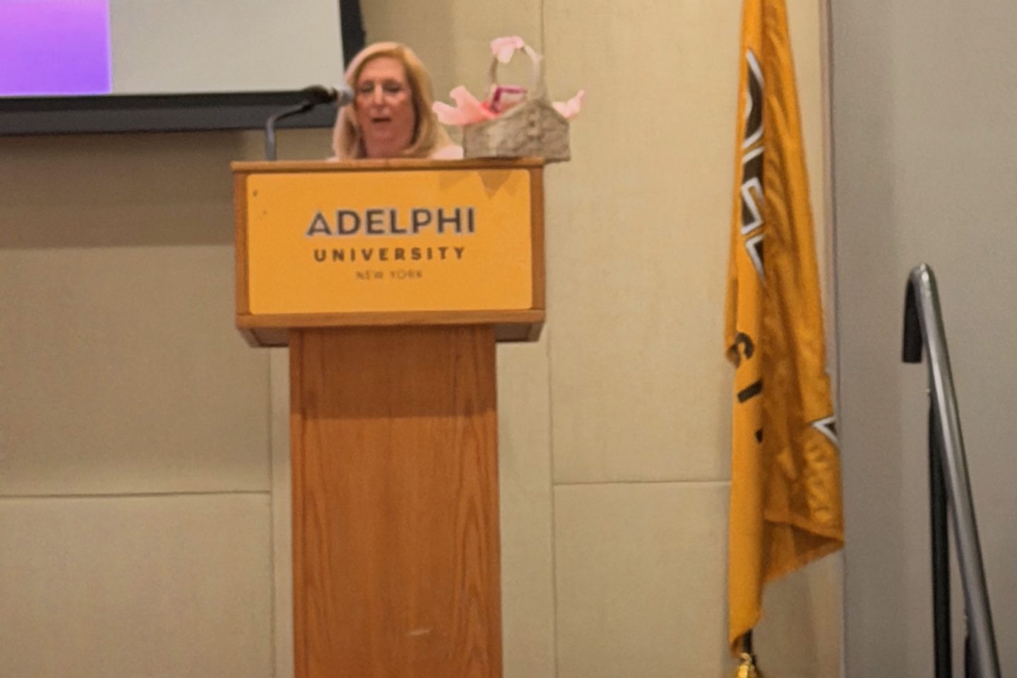 Women speaking at a podium