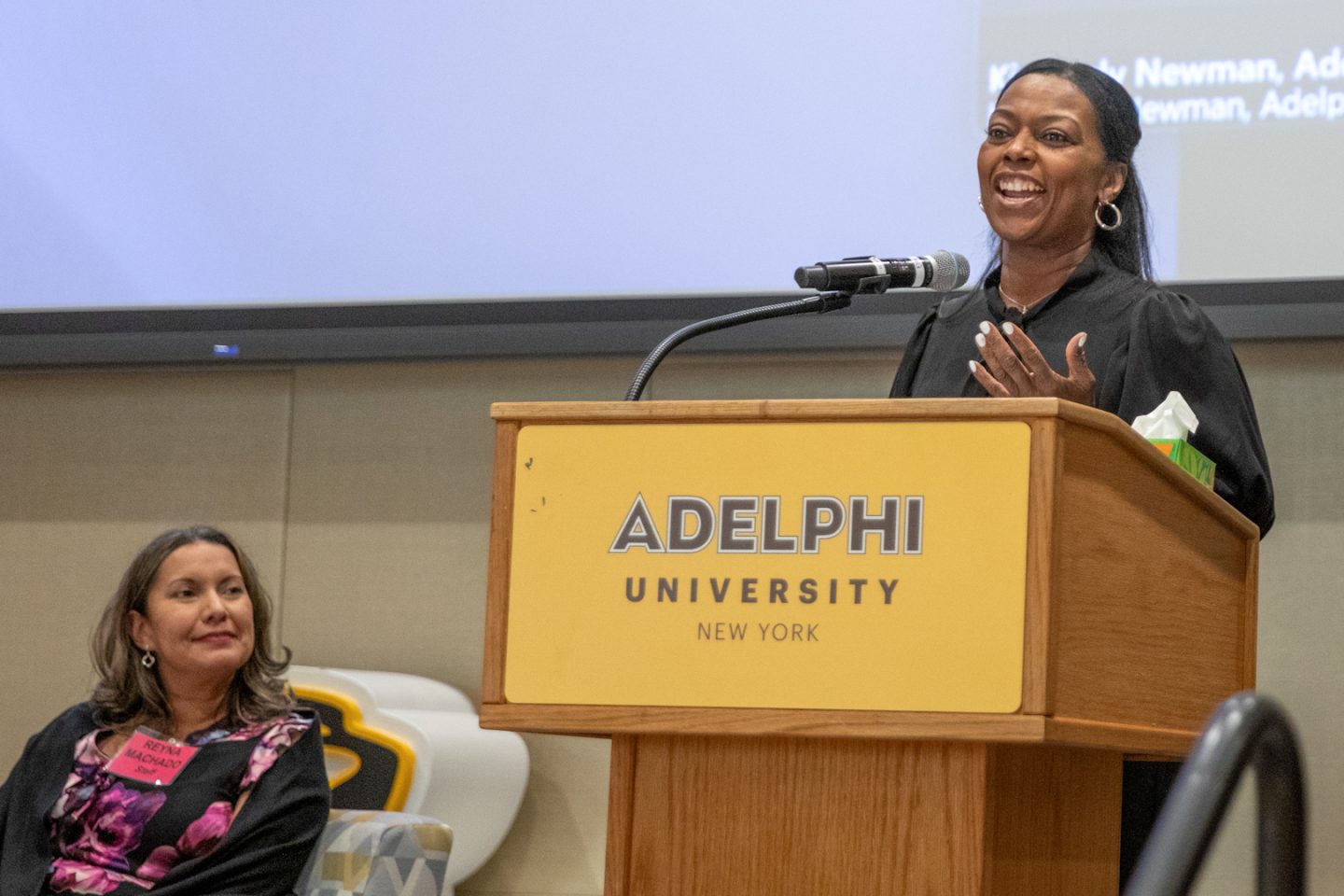 Women speaking at a podium