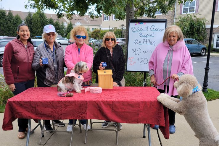 The Seasons at East Meadow Breast Cancer Fundraiser table selling raffles.