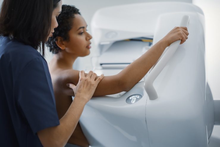 mammogram procedure with nurse assisting a patient