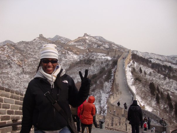A student poses for a picture on the Great Wall of China.