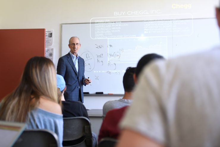 Robert Goldberg leading a Finance class at Adelphi University