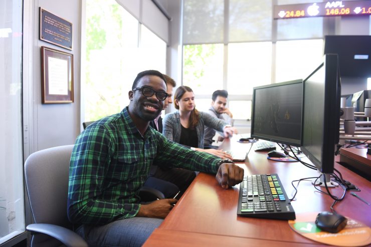 Adelphi students in the trading room in Hagedorn Hall