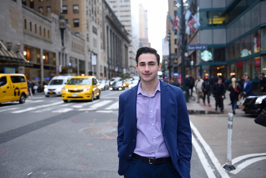Nicholas Sterlacci standing on a busy New York City street.