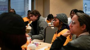 Adelphi students listening during lecture at Two Museums Program in DC