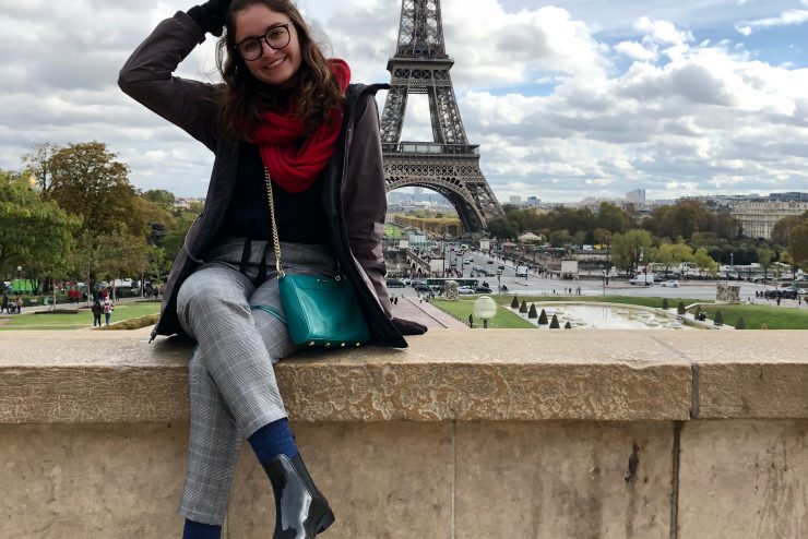 Adelphi student Olivia Tcholakian posing in front of the Eiffel Tower in Paris, France.