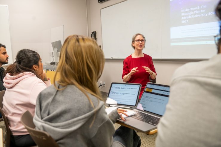 Professor Pam Buckle leading a classroom discussion on strategy.