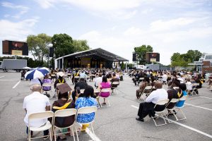 Graduating student and guests stand for pledge.