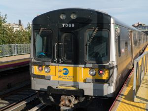 A view of an LIRR Train with MTA logo visible.