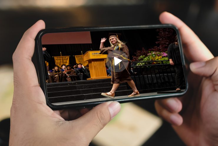 video clip of Adelphi graduate crossing stage