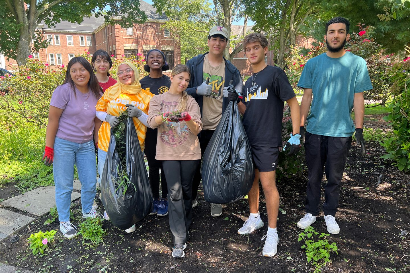 is our students volunteering at the Northport VA Medical Center, cleaning up the meditation garden for our veterans suffering from PTSD. This garden is an area they can go to connect with one another, talk about their experiences, and bring peace.