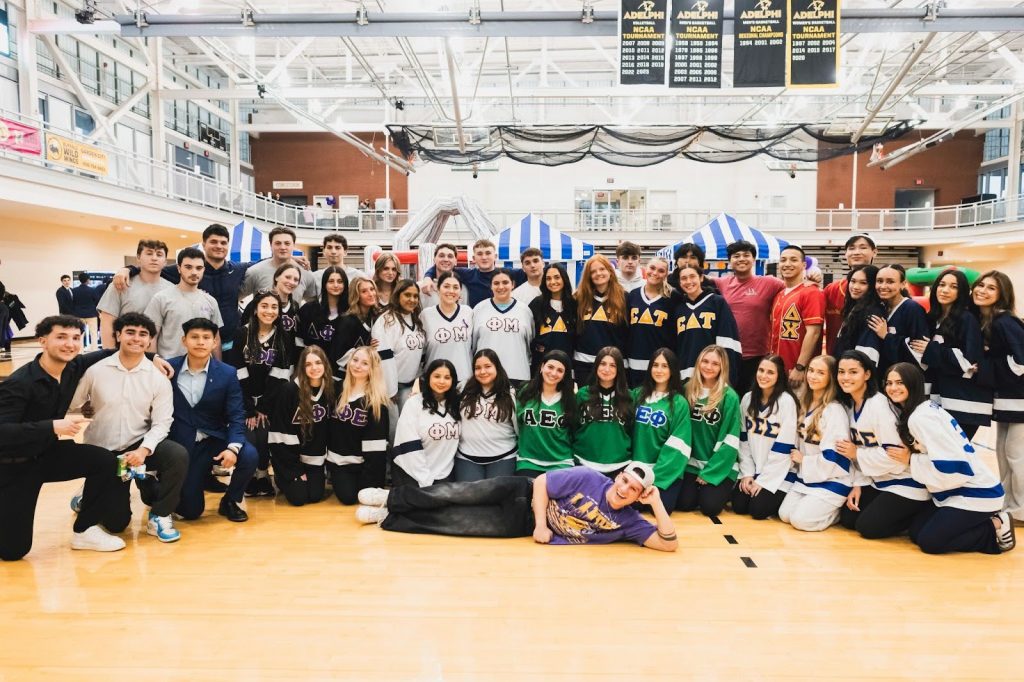 A group photo of students involved in greek life at Adelphi University.