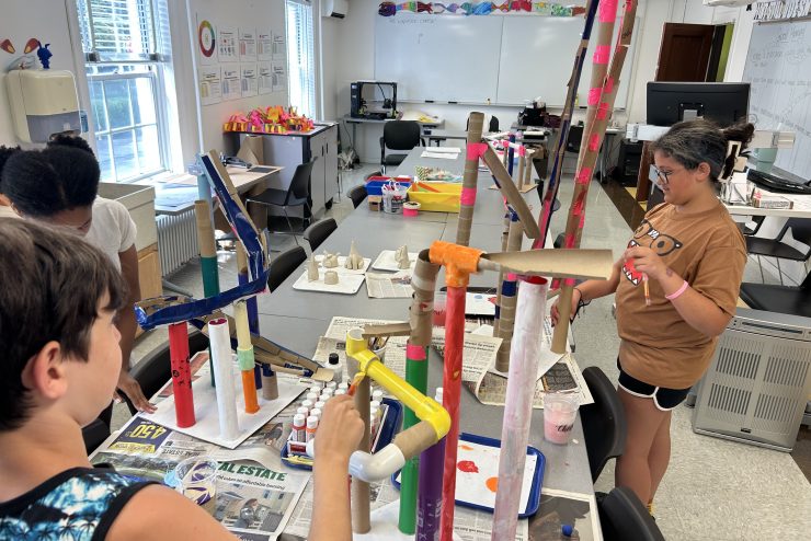 Adelphi art summer camp: elementary aged child works in clay.