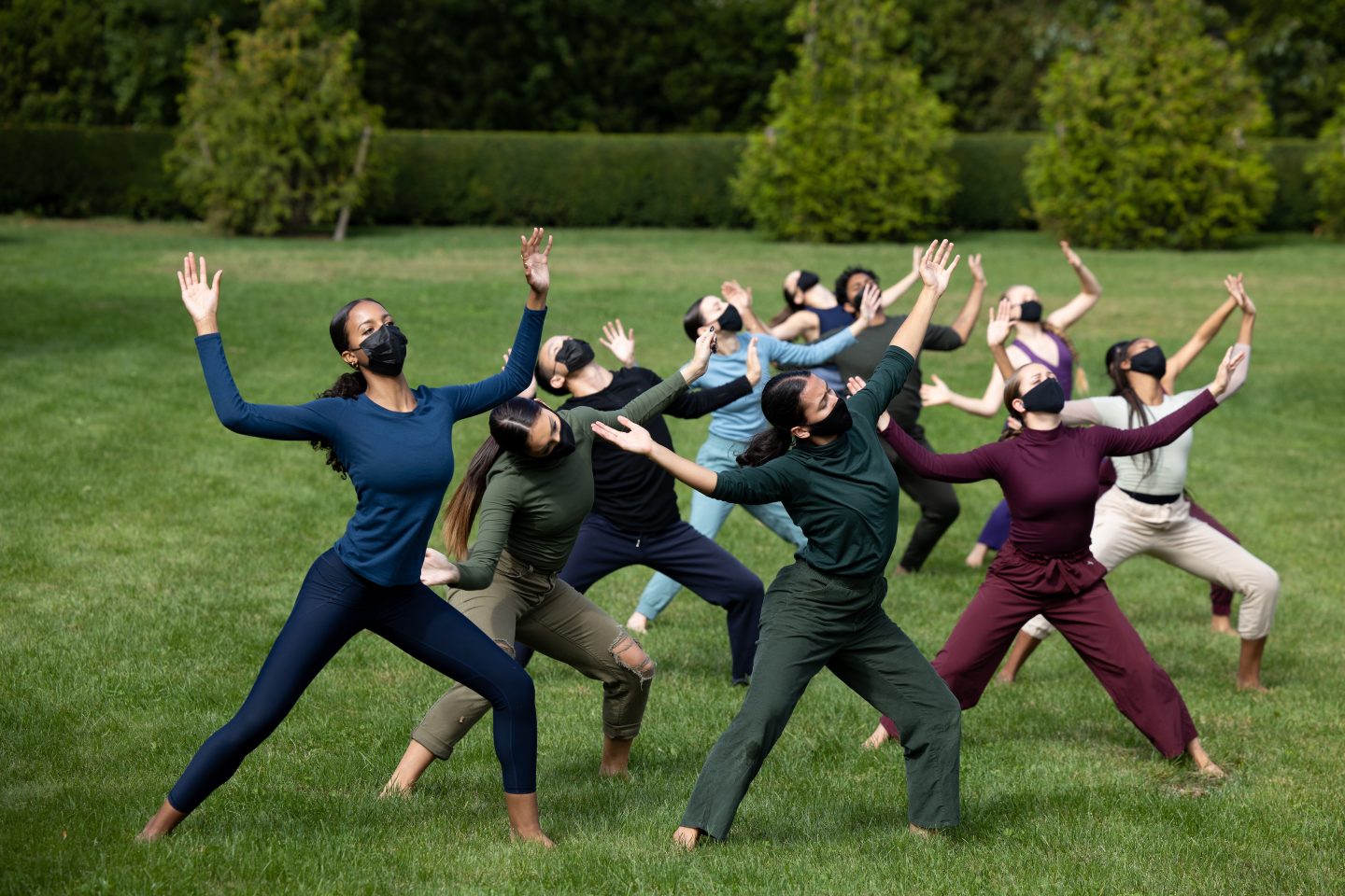 Masked Adelphi Dance students perform on the lawn during the Fall Arts Festival in 2021.
