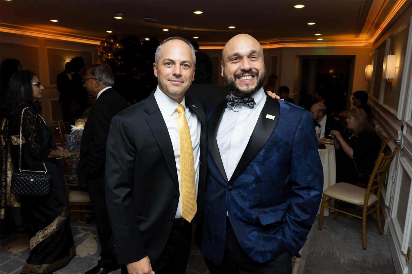 Two formally dressed men at the Gala. On the left is Thomas Kline, EdD, vice president of University advancement and external relations, with attendee Josh Rahmani ’06