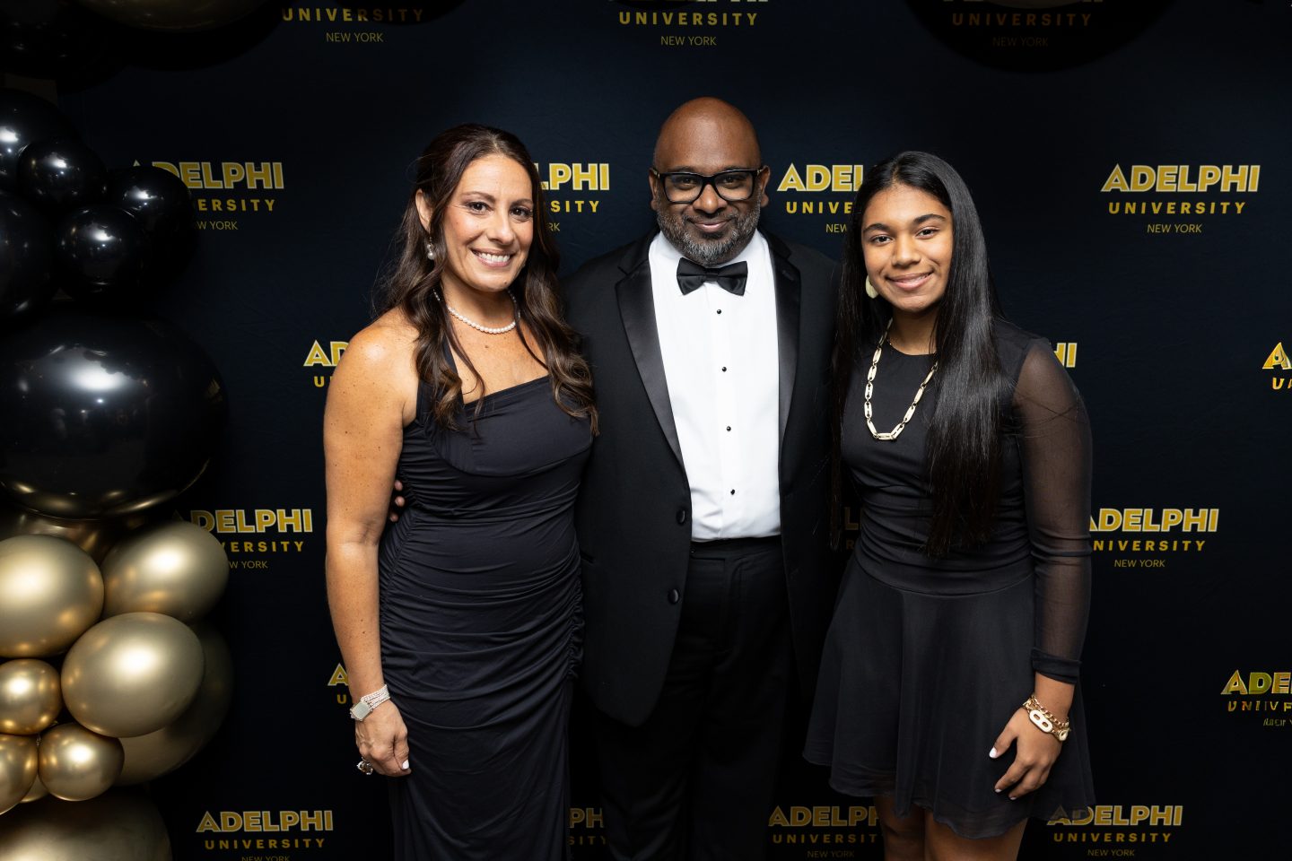 Board Chair Leonard C. Achan ’99 with his wife, Kimberly Mayo-Achan, and their daughter, Katherine.