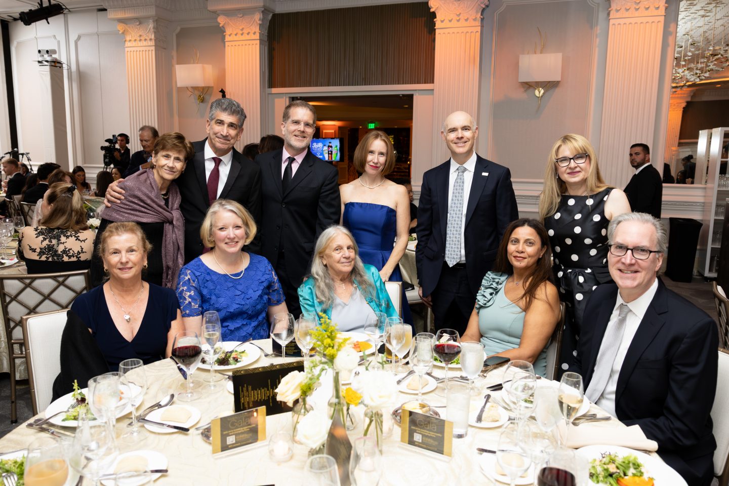 Adelphi faculty and leaders gather at the 2026 University Gala. Among those pictured are Christopher Muran, dean of the Gordon F. Derner School of Psychology, and his wife; Louise Geddes, interim dean of the College of Arts and Sciences; Christopher Storm, senior executive vice president and provost; Justyna Widera-Kalinowska, professor of chemistry and director of the SPARK Center; Bridget Maley, assistant professor in the College of Nursing and Public Health; Andrea Ward, vice provost for libraries and research; Roni Berger, professor of social work; Raghida Abdallah Yassine, assistant professor of business and Faculty Senate chair; and Trustee Steve Jones, BA ’89.