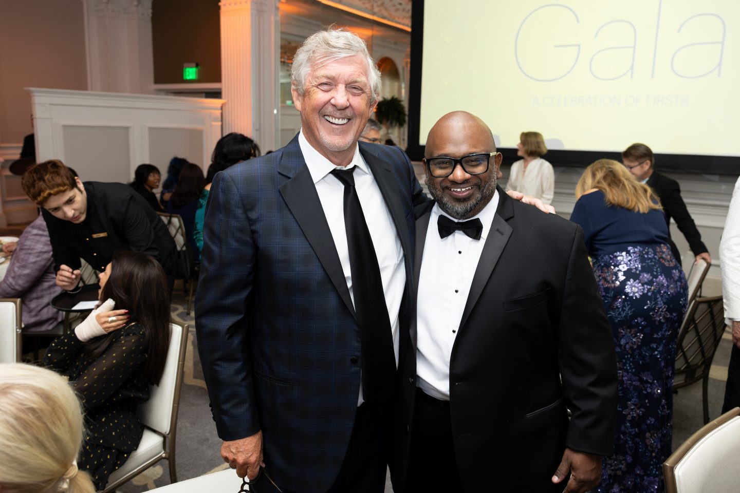 Board Chair Leonard C. Achan ’99 with Trustee Greg Carey.