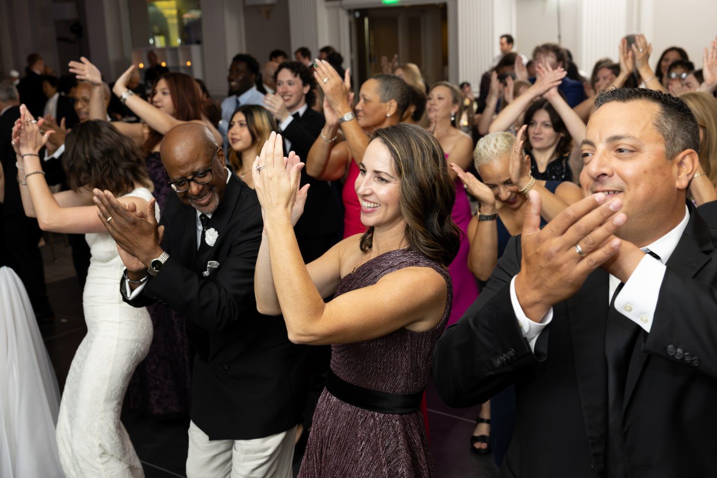 Everybody clap your hands! Guests enjoy the Cha Cha Slide, led by Trustee and former Board Chair Marc S. Strachan, BBA ’81.