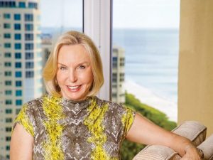 Paula Malone seated near a window.