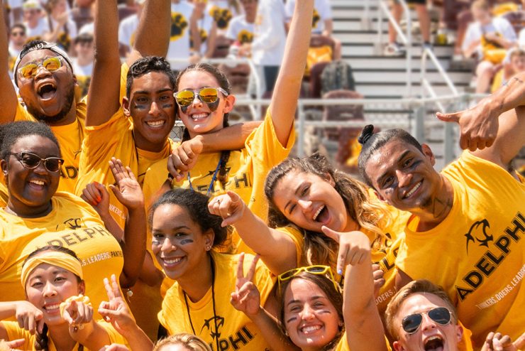Adelphi students joyfully shout during Orientation Week