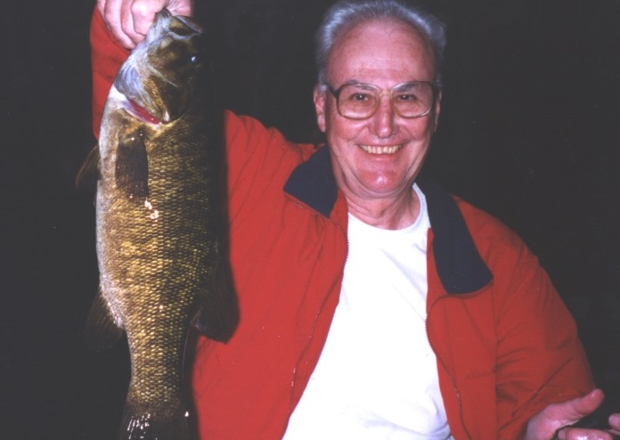 Patrick L. Ross holding a fish
