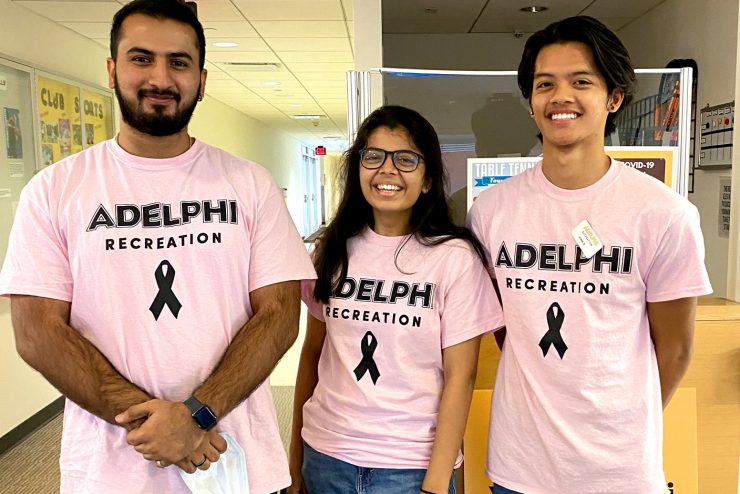 Adelphi community create a human pink ribbon in support of those affected by Breast Cancer